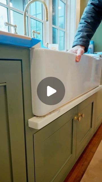 NS Builders on Instagram: "Apron sinks and water damage?  While there’s a lot to love about apron sinks, this style makes it easier for water to run down and ruin your cabinets below. This stone detail helps catch those drips and prevents that lower door from getting destroyed.  #nsb182 Architecture @stevetiek  Millwork @materiamillwork  Stone @metcabinet  Video @motifmediaco   #nsbuilders #builder #customhome #needham #countertops #stone #kitchendesign" River Kitchen Sink, Apron Front Countertop, Kitchen Sinks On Islands, Apron Sink With Towel Bar, Drip Rail Under Farmhouse Sink, Apron Sink Drip Ledge, Drip Edge Sink, Fireclay Sink Kitchen, Apron Sink With Drainboard