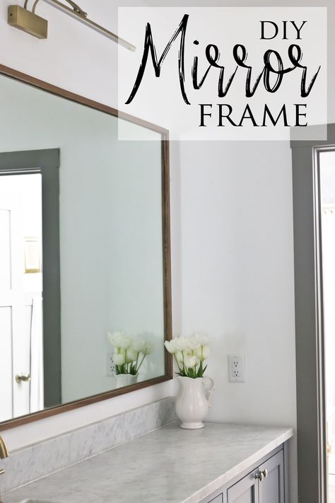 Discover this DIY wood mirror frame that saves you a ton of money and offers a beautiful custom look that just can't be bought in stores. For a relatively quick and easy DIY project, I think it made a huge impact on the design of this shared bathroom room in our pole barn house. Bathroom Mirror Sticker Frame, Diy Wood Framed Mirror Bathroom, How To Add A Frame To A Bathroom Mirror, Diy Bathroom Framed Mirror, Mirror Surround Diy, Making A Frame For A Mirror, Ideas To Frame A Bathroom Mirror, Trim Mirror Bathroom Diy Frame, Adding Frame To Bathroom Mirror