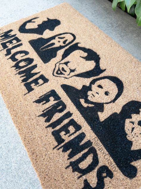 Horror Friends DoormatOur mats are made of 100% natural coir material with PVC slip resistant rubber backing. Natural surface provides durability and traction to wipe your shoes. Suitable for indoor and outdoor use.All of our designs are hand-painted made with love just for you.We use high quality, water resistant outdoor paints and UV Sealed for durability. Halloween Rug Stencil, Halloween Mat Stencil, Halloween Outdoor Mat, Halloween Welcome Mats Diy, Halloween Floor Mat, Hand Painted Door Mats, Halloween Doormat Ideas, Halloween Rugs Diy, Diy Halloween Doormat