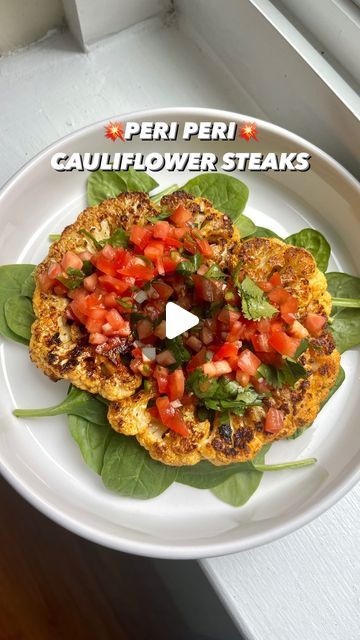 Dharini 🌱 on Instagram: "So excited to share my first recipe for April!!

💥Peri Peri Cauliflower Steaks💥
on a bed of spinach topped with a tangy tomato salsa!

For the salsa:
In a bowl, mix together:
1 tomato finely chopped
1 clove garlic finely chopped
Cilantro
serrano chili
Lemon juice
Salt 

#cauliflower #recipe #healthyrecipes #healthyfood #healthy #vegetarian #healthyvegetarian #vegan #veganrecipes #veganlife #lunch #steak #foodblogger #foodblog #love_food #food52 #eater #buzzfeast #feedfeed #f52grams #chennai #chennaifoodie #dc #washingtondc #sizzle" Cauliflower Recipe, Cauliflower Steaks, Peri Peri, Healthy Vegetarian, Vegan Life, Food 52, Meals For One, Tomato Salsa, A Bowl