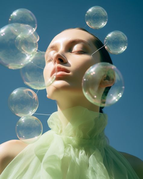 a girl is blowing bubbles down in the air Soap Bubbles Photography, Bubbles Photography, Future Society, Drawing Models, Editorial Inspiration, Bored Board, Berry Lips, Beauty Photoshoot, Bubble Art