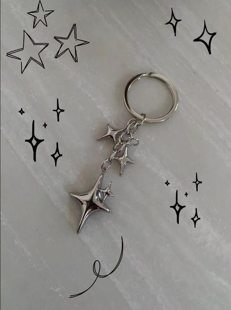 y2k star keychain! Total drop length: 3 IN Carabiner in the last photo is also on my page! Just an example of how to style the keychain :) Shipping 95% chance it will be there in under 14 days I Have a longer shipping time stated for the small chance it is not and there is trouble with the shipping process. If there are any problems I will do all I can to help DM me with any questions! Introducing the Y2K Silver Star Keychain--a delightful blend of nostalgia and elegance. This enchanting keychai Chrome Hearts Keychain, Keychain Aesthetic Ideas, Key Chains Aesthetic, Car Keychain Aesthetic, Cute Keychains For Car Keys, Keychains Aesthetic, Y2k Charms, Y2k Keychain, Cute Key Chains