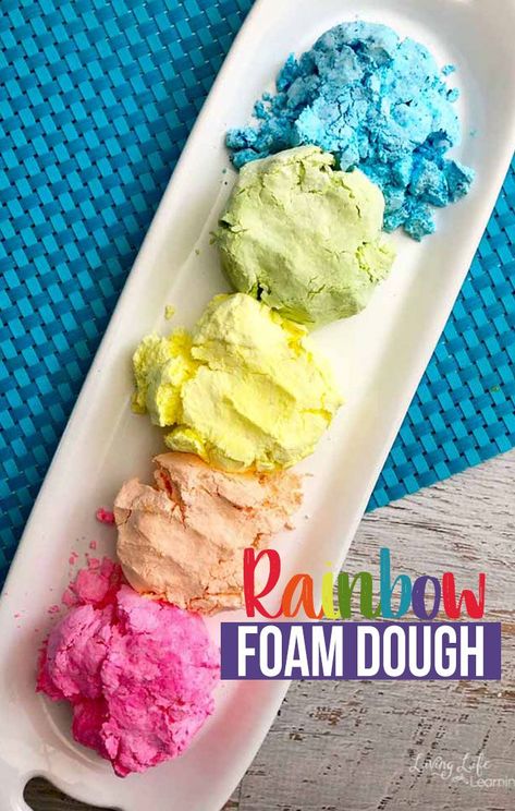 Not only is this Rainbow Foam Dough so much fun to play with, it also has a wide array of benefits for children. The colors of this foam dough are perfect for a rainbow unit or anytime you want to be surrounded by fun colors!  #sensory #developmentactivities #foamdough #rainbow #playdoughrecipe Rainbow Preschool Sensory Bin, Rainbow Fish Playdough, Rainbow Messy Play, Rainbow Foam Sensory Play, Table Provocations, Foam Dough, Rainbow Rice Sensory Bin, Sensory Center, Rainbow Sensory