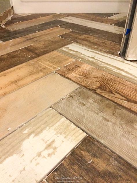 ALL you need to know about wood look tile! ❤️How to know if porcelain or ceramic wood grain tile is the right type of flooring or tile for you in your own home. Plus 53 affordable and gorgeous faux wood tile options #woodtile #woodlooktile #fauxwoodtile #porcelainorceramictile #tilereview #flooring #tile #tilefloor #tileshowerideas #bathroomtile #woodlooktilefloor #porcelainwoodtile #ceramicwoodtile #woodtileflooring Porceline Tile, Ceramic Wood Tile Floor, Wood Tiles Design, Wood Tile Shower, Wood Grain Tile, Wood Look Tile Floor, Faux Wood Tiles, Wood Wall Tiles, Wood Tile Bathroom