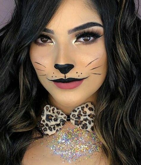 "Get ready to turn heads this Halloween with a fierce and stylish leopard costume! This wild and glamorous look is easy to create with a leopard print bodysuit, dress, or jumpsuit. Add cat ears, a tail, and leopard-inspired face makeup with bold eyeliner, whiskers, and spots to complete your transformation. Perfect for anyone looking for a fun yet fashionable costume, the leopard look is versatile and can be accessorized with dramatic nails, bold eye makeup, and statement heels. Cat Makeup Halloween Pretty, Cat Eye Makeup Halloween, Leopard Halloween Costume, Leopard Makeup Halloween, Cat Costume Makeup, Cat Face Paint, Black Cat Makeup, Cat Face Makeup, Simple Cat Makeup