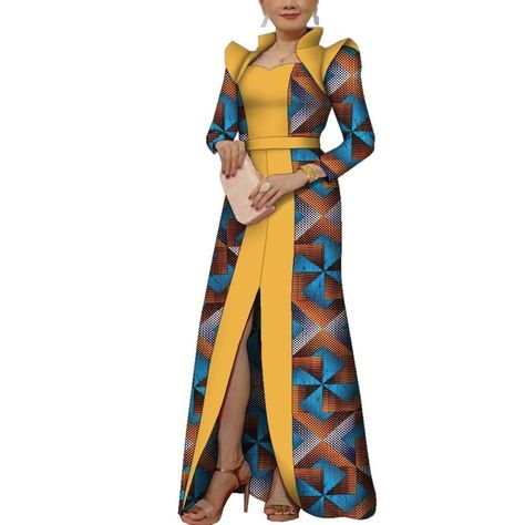 PRICES MAY VARY. 99% Cotton, 1% Other Fibers Zipper closure Dry Clean Only fashion African dresses for women,clearly ankara floral printed,patchwork craft,high collar design shown lady fashion,simple;In the front of clothes long split shown sexy and elegant,it is the best choice to african party wedding evening wear for lady Clothes Material:African wax print fabric,cotton 100%;Clearly ankara floral printed,nonelastic;The fabric is a bit hard, but don't worry, the fabric will become soft when yo African Dress Patterns, Lady Clothes, Afrocentric Fashion, Clothes Material, Dashiki Dress, Elevated Casual, African Maxi Dresses, Maxi Dresses Fall, Lace Styles