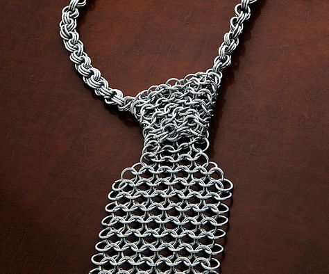 Channel the skill and valor of a brave knight when you don the chain mail necktie at the office. This unique necktie is made entirely from chain mail and fits a variety of neck sizes up to 23" and are far more effective than power ties for charging through any office battle. Chainmail Clothing, Weird Gadgets, Think Geek, Geek Fashion, Tie Styles, Chain Mail, Gifts For Men, Necktie, Cool Gifts