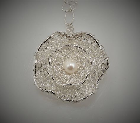 Hand crocheted fine silver wire with sterling silver and 4 mm freshwater pearl flower pendant with 18 in long sterling silver chain. Pendant measurements: 1.75 x 1.75 x 0.5 in. Crochet Pendant, Crochet Silver, Metal Jewelry Making, Silver Chain Pendant, Wire Crochet, Wire Jewellery, Pearl Flower, Chain Pendant, Flower Pendant