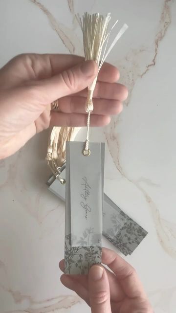 Kristin Hazelwood on Instagram: "We love an escort card card that doubles as a favor. These sweet bookmarks in sage green with a touch of floral from the invitation suite plus guest name in vellum, complete with ivory tassel were no exception! . #hazelwoodpaperco #fortworthweddings #weddingstationery #weddingstationer #luxurystationery #stationery #customstationery #stationerydesign #stationerydesigner #weddingdetails #escortcards #weddingescortcards #bookmarks" Place Holder, Luxury Stationery, Custom Stationery, Card Card, Invitation Suite, Wedding Details, Stationery Design, Sage Green, Wedding Stationery