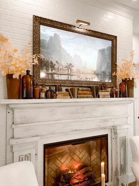 Fall Mantel using Vintage Amber Bottles - Deb and Danelle Vintage Inspired Mantle Decor, Fall Halloween Mantel Decor, Vintage Mantel Decor, Mantle Decor Vintage, Vintage Mantle Decor With Tv, Electric Fireplace With Vintage Mantle, Vintage Fall Mantle Decor, Antique Mantle Decor, Vintage Fall Home Decor