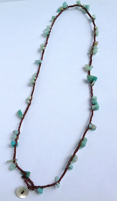 Teal chipped semi precious stone beads on warm chocolate nylon thread. This necklace closes with a mother of pearl button. Stone Chip Necklace, Thread Necklace Diy, Stone Necklace Diy, Necklace Thread, Semi Precious Stone Jewelry, Handmade Crystal Necklace, Ankle Bracelets Diy, Macrame Bracelet Patterns, Thread Necklace