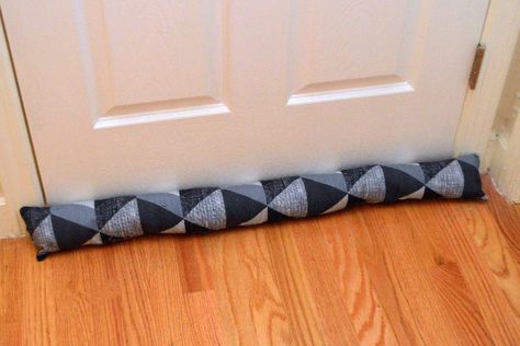 How to Make a Door Draft Stopper | DoItYourself.com Diy Door Snake Draft Stopper, Door Snake Draft Stopper, Door Wind Stopper, Draft Stopper Diy, Draft Snake, Homemade Door, Diy Renewable Energy, Draft Blocker, Draught Excluders