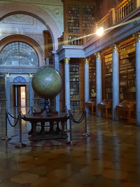 big spacious library with a big earth globe in the middle Science History Aesthetic, Dark Academia History Student Aesthetic, Dark Academia History Aesthetic, History Job Aesthetic, History Academia Aesthetic, Geography Class Aesthetic, History Lesson Aesthetic, Humanities Major Aesthetic, Ap European History Aesthetic