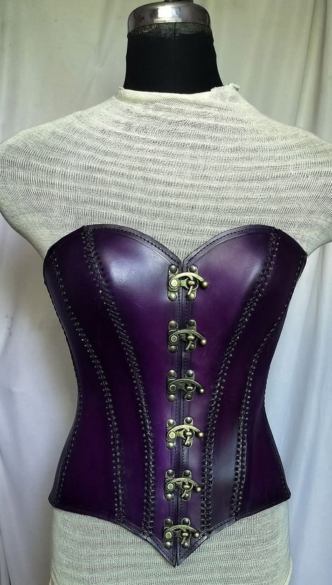 It is handmade leather corset with hand-sewn leather detailing. At front is closed with Lock and back side is adjustable with buckles. We used about 2 to 2.2 mm thick handmade leather. It is hand dyed handmade leather. It is crazy for Gothic, Steampuck costumes and medieval events and Larp.   Corset is hand made from sturdy top-grain leather.  Size is available from 30 to 46 inch, please check our size chart. Bust size in size-chart. DETAILS: ► 100% Handmade ► 100% Genuine leather ► Made on your Punk Corset For Halloween Larp, Punk Underbust Corset For Fantasy Events, Punk Style Corset For Fantasy Events, Steampunk Leather Corset For Cosplay, Steampunk Corset For Festival, Steampunk Corset Belt For Fantasy Events, Fitted Leather Corset For Cosplay, Fitted Leather Overbust Corset, Gothic Leather Corset For Cosplay