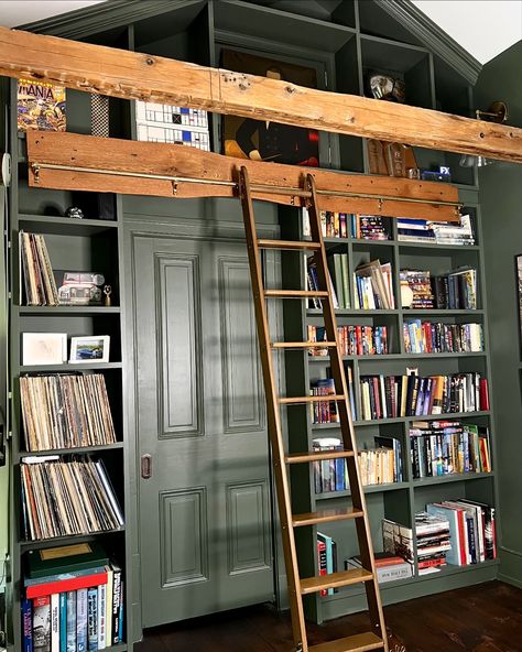 There are stunning brass details on the library ladder we found through an architectural salvage company. The brass roller covers have beautiful curves and the letter P embossed. Each step has a bass rod that runs below it and the hooks on the top of ladder that connect to the brass bar allow the ladder to slide beautifully. We love to find vintage pieces that would have been destroyed or sitting in a cold warehouse if not repurposed. The stories and history that you can dream up behind eac... Library Shelf With Ladder, Antique Library Ladder, Brass Library Ladder, Library Ladder Kitchen, Rolling Ladder Bookshelf, Sliding Ladder Bookshelf, Bar Ladder, Ladder Art, Library Steps