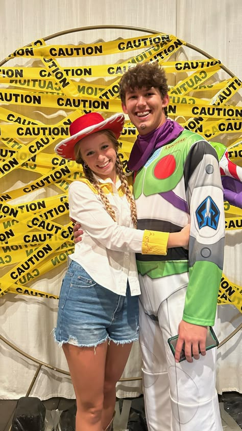 toy story characters, toy story costume, couple costumes, buzz lightyear, halloween, halloween party, costumes, halloween decorations, jessie, toy story, funny costumes, caution tape background, picture walls, halloween funny backdrops, halloween poses, pictures with friends, football, cute photo wall, boots, cowgirl, balloon wall, couples, boyfriend, girlfriend, couples at halloween parties, hugging pictures, pumpkin carving, pumpkin, solo halloween costumes Buzz Lightyear And Jessie Costume, Buzz And Jessie Costume Couple, Buzz And Jesse Couples Costume, Jesse And Buzz Costume, Halloween Boyfriend And Girlfriend Costumes, Jessie And Buzz Costume, Buzz And Jessie Costume, Jesse From Toy Story Costume, Jesse Toy Story Costume