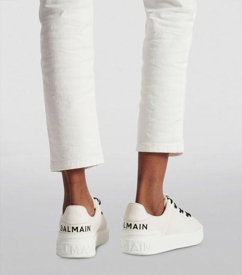 Find BALMAIN Leather B-court Sneakers on Editorialist. For those in search of a more refined Balmain shoe, the B-Court sneakers strike a perfect balance between sophistication and contemporary relevance. Adorned with the Houses iconic logo, these shoes will lend themselves to elevate your capsule wardrobe, courtesy of Olivier Rousteings trail-blazing vision. Balmain Shoes, Olivier Rousteing, Iconic Logo, Perforated Leather, Embossed Logo, White Shoes, Sneakers White, Sneakers Black, Tennis Shoes