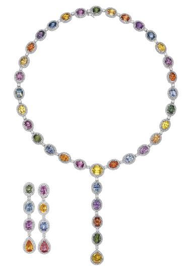 Comprising a necklace, designed as a series of oval-cut multi-color sapphires, within circular-cut diamond surrounds, accented by circular-cut diamond spacers, suspending a line of similarly set oval and pear-shaped sapphires; a pair of similarly designed ear pendants en suite, mounted in 18K white gold, necklace length 23 inches, ear pendant length 2 1/4 inches. River Necklace, Colored Sapphires, Color Stones Jewelry, Titanic Jewelry, Bridal Jewelry Vintage, Jewellery Design Sketches, Expensive Jewelry Luxury, White Gold Necklace, Jewellery Sketches