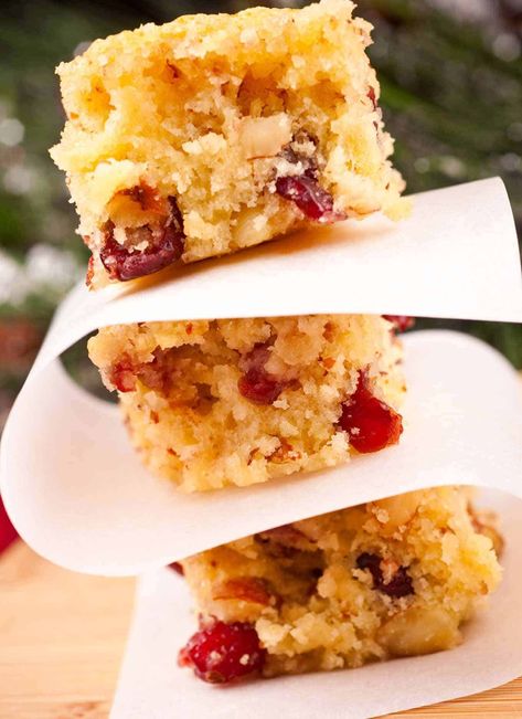 Easy-to-make, buttery blondies flavored with orange juice, orange zest, dried cranberries and slivered almonds. #baking #recipe #dessert #recipe Orange Bars, Dried Cranberry, Baked Apple Recipes, Light Desserts, Bar Recipes, Cranberry Orange, Bars Recipe, Orange Recipes, Desserts Recipes