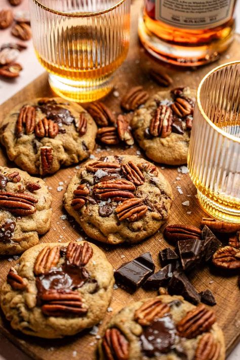 These easy, soft, and gooey bourbon pecan chocolate chip cookies start with bourbon-soaked pecans and are mixed with loads of chocolate chips and the perfect cookie dough! If you love bourbon and chocolate, these are the PERFECT cookies for you! Bourbon Chocolate Sugar Cookies, Chocolate Bourbon Cookies, Bourbon Butterscotch Cookies, Whiskey Chocolate Chip Cookies, Bourbon Cream Cookies, Bourbon Pecan Chocolate Chip Cookies, Bourbon Chocolate Chip Cookies, Bourbon Treats, Bourbon Pecan Cookies