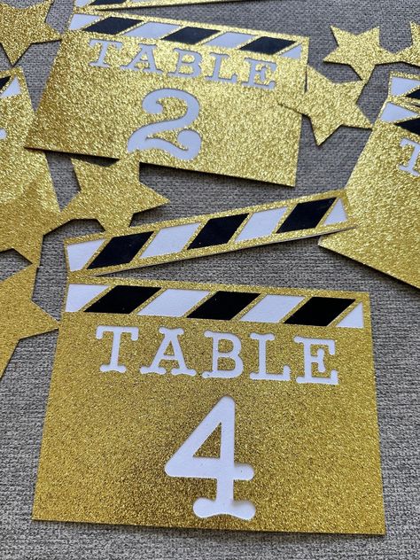 Beautiful and unique Hollywood theme table numbers to match your party or event and add an extra touch to your guests tables. They can be use with a holder or they can be incorporate as a centerpiece or on a centerpiece.  It can be customize in any color...just leave me a note when you place your order. Also you can choose if you want it to say "Take #" or "Table #". Measures: Approx. 7" H x 7.5" W (all together) Perfect for weddings, birthday, graduation, corporate events, charities events, gal Oscars Party Centerpieces, Hollywood Glamour Decor Party, Quince Hollywood Theme, 50s Hollywood Glam Party, Old Hollywood Ball Theme, Red Carpet Theme Centerpieces, Hollywood Regency Wedding Decor, Party Themes For Graduation, Hollywood Glam Sweet 16 Party