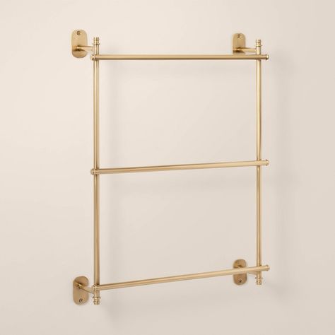 Organize your bathroom towels in style with this Wall-Mounted Brass Ladder Towel Rack from Hearth & Hand™ with Magnolia. This ladder-style towel rack features a wall mountable design with three bars for hanging your bath towels and more in one place. Made from metal in a lacquered brass finish, it easily coordinates with a wide range of bath decor. Hearth & Hand™ with Magnolia: Gather • Create • Enjoy Guest Bathroom Towel Storage, Towel Bar Small Bathroom, Multiple Towel Bars In Bathroom, Towels Small Bathroom, Bathroom Wall Towel Rack, Antique Towel Bar, Bathroom Wall Accessories, Bathroom Shelves Towels, Blanket Ladder Wall Mount