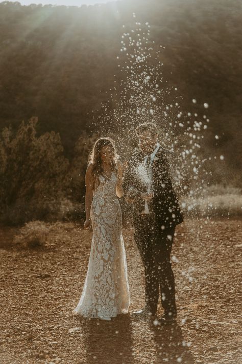 Wedding Champagne Spray Photo, Champagne Wedding Photography, Champagne Popping Pictures Wedding, Elopement Champagne Pop, Wedding Champagne Photo, Wedding Champagne Spray, Champagne Pop Wedding Photo, Champagne Spray Engagement Photo, Champagne Pop Photoshoot