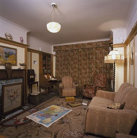 The 1940s House Living Room - a typical 1930s interior recreated for the 2001 TV series, and subsequently displayed (but, alas, no longer) at the Imperial War Museum, London 1930 Light Fixtures, 1940s House Aesthetic, 1940s Apartment New York, 40s Living Room, 40s Apartment, 1960 Living Room, 40s Interior Design, 1940s Curtains, 40s Interior