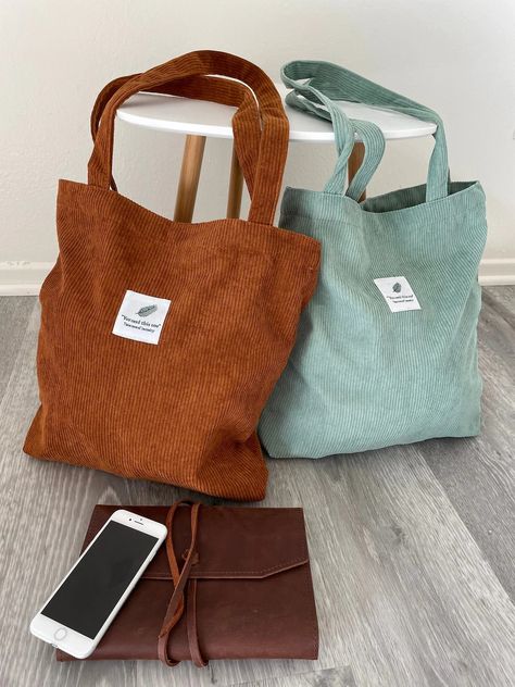 an orange and light blue/green corduroy tote bag from amazon. Click the image to get to the link (site is amazon) School Minimalist, Minimalist Shoulder Bag, Handbag Ideas, Uni Bag, Corduroy Tote Bag, Tote Bags For School, Diy Tote, Bag Pocket, Bag Designs