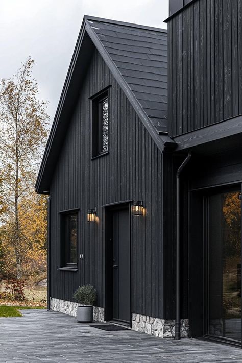 40 All Black Houses That Wow All Neighbors Scandinavian Brick House, Black Metal Exterior House, Iron Ore Board And Batten Exterior, Black Painted Brick House, Black Timber House, Black Exterior House With Wood Accents, Black House With Brick, Black House With White Trim, Black And Brick House Exterior