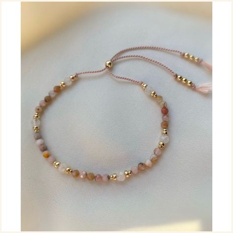 [PaidLink] Delicate Peruvian Pink Opal And Moonstone Gemstone Bracelet Made With A Blush Pink Thread And 14Kt Gold Filled Beads. The Bracelet Has A Slider Bead, Which Makes It Easy To Adjust The Tightness To Your Liking. Individually Selected High Quality Gemstones Make The Bracelet Truly Special And One Of A Kind. The Delicate And Minimalist Design Goes Well With Both Casual And Sophisticated Looks. You Can Layer The Bracelet Or Wear It By Itself. Total #diydaintybracelet Dainty Crystal Bracelet, Beaded Bracelets Packaging, Pink Opal Bracelet, Self Made Bracelets, Gemstone Bracelets Ideas, Bracelet Stones, Bracelets Stone, Kalung Manik-manik, Bracelet Cord