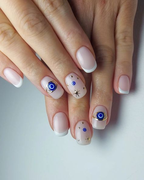 Discover 22 captivating Evil Eye nail designs! Dive into this trending nail art and learn how to DIY for a touch of mystique and style. Unveil your inner enchantress! Click the article link for more photos and inspiration like this // Photo Credit: Instagram @jark.nails // #acrylicnails #acrylicnailsstyles #bestnailstyles #elegantnails #evileyemanicure #evileyenail #evileyenaildesigns #evileyenailideas Evil Eye Manicure Short Nails, Evil Eye Nails Design Short, Evil Eye Short Nail Designs, Spiritual Nails Designs Short, Evil Eye Square Nails, Hamsa Nail Art, Greek Eye Nail Art, Evil Eye Nail Art Design, Evil Eye Acrylics