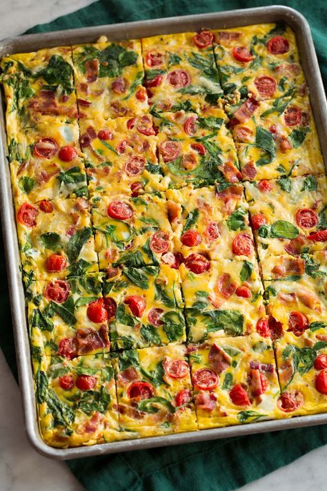 Easy Sheet Pan Eggs are oven baked eggs made with a variety of mix-ins of choice including cheese, meat, and vegetables. They're great for breakfast sandwiches and make ahead breakfast. Bake Eggs In Oven Breakfast Sandwiches, Make Ahead Egg Dishes For Breakfast, Pre Cooked Breakfast Ideas, Muffin Pan Eggs Recipes, Vegetable Egg Bake Casserole, Sheet Pan Breakfast Egg Sandwich, Sheet Pan Egg Recipes, Cheesy Egg Bake, Egg White Sheet Pan Eggs