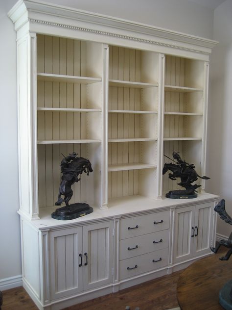 built in bookcase with beadboard | Grand Bookcase with adjustable shelving, storage drawers and enclosed ... Beadboard Bookcase, Beadboard Shelves, Cabinet Bookshelves, Farmhouse Bookcases, Shelving Wall, Bookshelf Door, Study Storage, Bookcase With Drawers, Bookshelf Cabinet