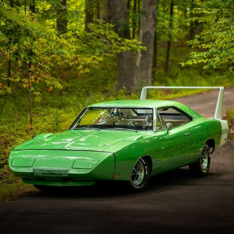 This 1969 Dodge Daytona is finished in Bright Green Metallic with a White wing and is equipped with 440/375 HP Magnum V-8 engine and an automatic transmission. It will cross the auction block on Saturday, September 10, 2022 at Mecum's Dallas auction. Dodge Daytona 1969, Plymouth Daytona, Cars Parking, 1969 Dodge Charger Daytona, Dodge Hemi, 70s Muscle Cars, Chrysler Newport, Dodge Daytona, Dodge Charger Daytona