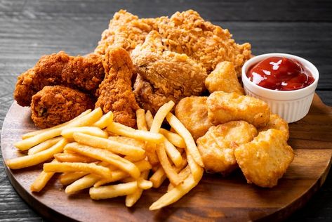 Fried chicken with french fries and nugg... | Premium Photo #Freepik #photo #chicken-nuggets #nuggets #fries #french-fry Chicken Fries, Chicken And Chips, Nigerian Food, Foods To Avoid, Food Platters, Fried Food, Food Safety, Food Obsession, French Fries