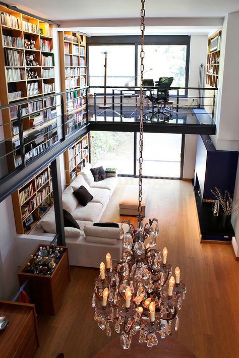 modern contemporary living room with mezzanine..This modern maisonette is built in the oldest northern suburb of Palaio Psychiko in Athens, Greece. Located among the residential architecture of the 20th century, the maisonette combines antique furniture with industrial design and trends of a modern lifestyle. Living Room With Mezzanine, Modern Contemporary Living, Industrial Lighting Design, Modern Contemporary Living Room, Home Library Design, Home Libraries, Loft Design, Library Design, Hotel Decor