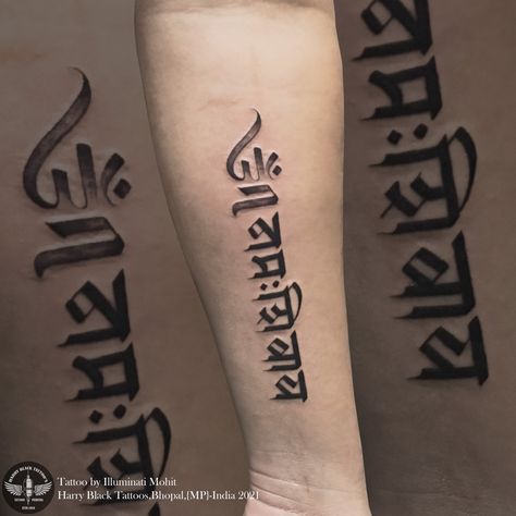 The shape of om has the face of a smiling Shiva that makes it a modern Indian design. This tattoo symbolizes peace and prosperity Omm namaha shivaya tattoo by - @illuminatimohit Only at Harry black tattoos dB city mall bhopal For consultation and appointment 07552514759/9981271965 #illuminatimohit #tattoolife #tattoobyilluminatimohit #ommnamahshivaya #tattoo Ohm Namashivaya Tattoo, Smiling Shiva, Om Namah Shivay Tattoo, Om Namah Shivaya Tattoo, 19 Tattoo, Hanuman Tattoo, Harry Tattoos, Mahadev Tattoo, Avengers Drawings