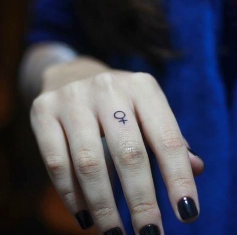 CafeMom.com : Though she may be little ... : 21 Feminist Tattoos to Celebrate Our Power -- Here is a tiny reminder that carries a massive message to smash the patriarchy every day. Tattoo by Evelyn Hell. More from CafeMom: 21 Hand Lettered Tattoos in the Most Beautiful Fonts