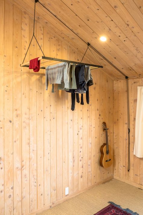 George and Willy's Urban Cabin House Remodel—in the New Zealand Suburbs Pulley Decor, Urban Cabin, Hanging Clothes Drying Rack, Buy Kitchen Cabinets, George And Willy, Vinyl Blinds, Hanging Laundry, Adirondack Furniture, Laundry Rack