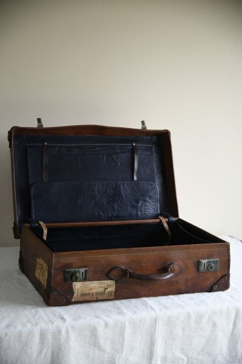 Antique Leather Suitcase. Antique brown leather suitcase, intials S L to the exterior. Dimensions: 67cm wide x 18cm deep x 42cm high. Condition: Age and wear due to the nature of the item, some historic travel labels. Delivery: Free delivery quoted covers UK Mainland only. This is an economy service. The item will be delivered in 2-3 working days. For express service, please make enquiries. Old Leather Suitcase, Leather Suitcase Vintage, Vintage Travel Suitcase, Antique Vintage Bedroom, Vintage Suitcase Aesthetic, Antiques Aesthetic, Vintage Suitcase Decor, Antique Suitcase, Suitcase Decor