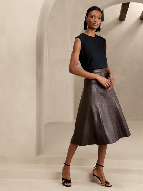 A mastery of movement, this midi skirt uses godet detailing and beautiful stitching for extra swing with every step.  Our designers employed the sumptuous texture of leather as a luxurious finish.  A-LINE: High-waisted.  Flared from waist to hem.  Hidden zip with hook-and-eye closure at wearer's left side.  Fully lined.  LEATHER WORKING GROUP: By purchasing this product, you are supporting responsible leather manufacturing through the Leather Working Group.  A-line: High waisted.  Fitted through Brown Leather Skirt, Wardrobe Consultant, Godet Skirt, Business Skirt, Long Denim Skirt, Women Short Skirt, Leather Midi Skirt, Maxi Styles, Slip Skirt