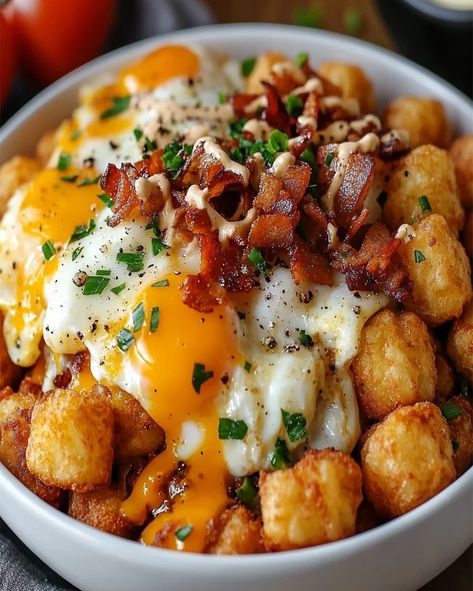 This Tater Tot Breakfast Bowl Recipe combines crispy tater tots, savory sausage gravy, and eggs for a delicious and satisfying breakfast. Tater Tots For Breakfast, Tator Tot Breakfast Egg Bake, Tater Tot Bowl, Tater Tot Recipes Breakfast, Breakfast Ideas With Tater Tots, Tater Tot Breakfast Bowl With Sausage Gravy, Tater Tot Waffles, Breakfast With Tater Tots, Tator Tot Egg Casserole Breakfast