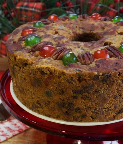 This old-fashioned White Fruitcake is baked 4 weeks in advance and covered with a wine-soaked cloth, resulting in a moist and flavorful fruitcake.  It’s made with lots of fresh pecans and candied cherries and pineapple.  No citrus rind!!!    STOP!!  Don’t run!!  When you think about fruitcake, you probably think about those nasty little store-bought … Cake Light, Fruit Cake Recipe Christmas, Tube Cake Pan, Candied Pineapple, Cake Vegan, Fresh Cake, Fruit Cake Christmas, Candied Fruit, Cherry Candy