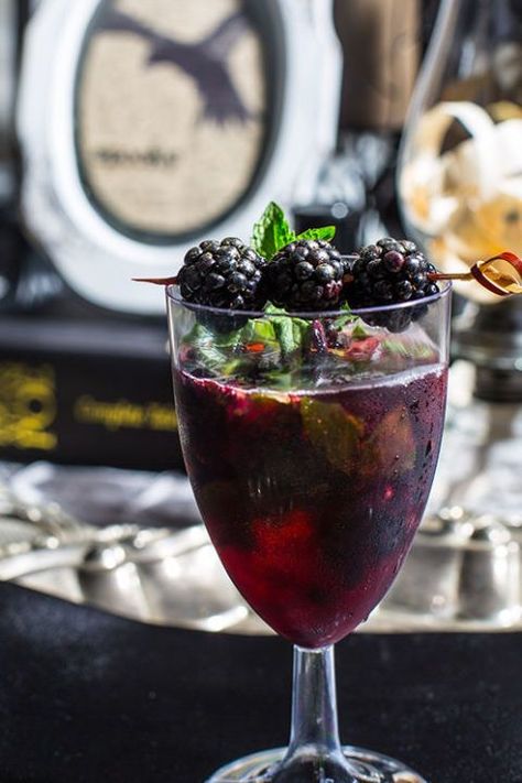 Delicious Halloween Cocktail Recipes. Blackberries, fresh mint leaves, white rum, and cranberry juice combine for a dark, delicious ode to Poe. Easy Halloween Cocktails, Spooky Cocktails, Blackberry Cocktail, Smoker Cooking, Drink Responsibly, Halloween Cocktails, Dry Ice, Halloween Dinner, Halloween Drinks