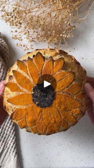 683K views · 6.8K reactions | 🌻Sunflower Sourdough Score🌻

This elegant, yet simple score by Rachel (@sourdough_enzo) is a perfect way to elevate your next sourdough loaf for summer! 

Use a circle cookie cutter in the center and fill it with black sesame seeds. Dust the bread with turmeric powder and score the petals. Remember to do the expansion score at 7 minutes, so the petals really lift off the loaf.

#sourdoughbread #scoring #scoringbread #scoringsourdough #sunflowerscore | CBC Life | Bertholet · Sunflower Sourdough Score, Bread Scoring, Sourdough Loaf, Black Sesame Seeds, Healthy Bread, Sourdough Bread Recipe, Turmeric Powder, Black Sesame, Lift Off