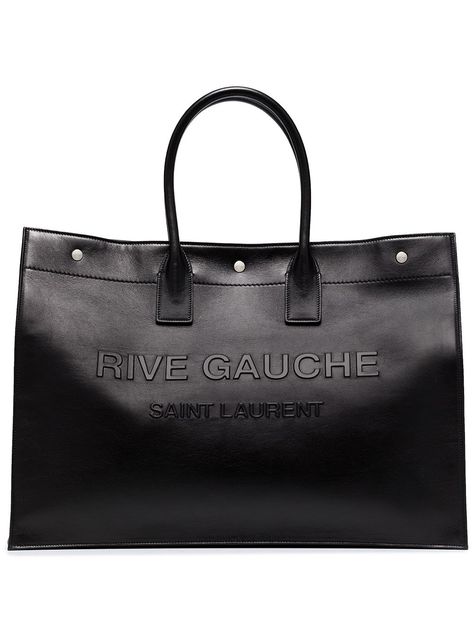 Shop or share your style of the product on ModeSens! Black leather large Rive Gauche leather tote bag from SAINT LAURENT featuring embossed logo to the front, silver-tone stud detailing, magnetic fastening, two top handles and main compartment. Tote Bag For Men, Saint Laurent Tote, Idea Product, Men Bag, Black Leather Tote Bag, Coach Horse And Carriage Tote, Rive Gauche, Leather Cap, Saint Laurent Bag