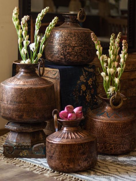 Brass pots are symbols of prosperity. Handcrafted with details to create a graceful embellished that is functional, beautiful and everlasting. Adorn your spaces by placing them as a statement centrepiece or add some fragrant blooms to bring vibrance. #thepurpleturtles #welcomehome #homedecor #homedecorideas #indianhome #indianhomedecor #indianhomedecorideas #indianart #traditionalart #decorindia #brassdecor #traditionalstyle #indianstyling #antiquedecor #vintagedecor #collectibleart Marigold Wedding Decoration, Brass Decor Indian, Indian Inspired Decor, Unique Lights, Antique Home Decor Ideas, Vintage Brass Decor, Diwali Decorations At Home, India Home Decor, Antique Wall Decor