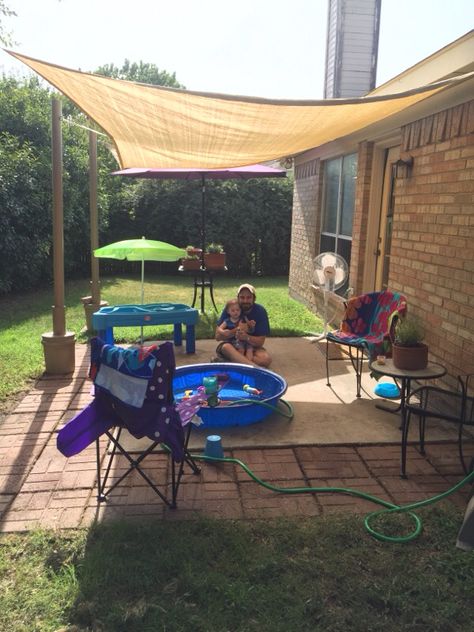 Our DIY rental house patio makeover with movable 10x13 shade sail attached to spray painted PVC pipe cemented into 5-gal buckets. All for just under $100. Plus we repurposed leftover pavers from the previous tenant to extend the existing concrete patio slab. Perfect for our family during those hot Texas summers!!! Temporary Patio Ideas For Renters, Backyard Rental House Ideas, Extend Concrete Patio, Leftover Pavers, Sunshade Ideas, Rental Backyard, Concrete Patio Makeover, Small Pergola, Small Outdoor Patios