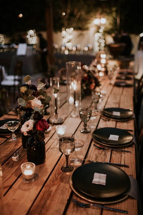 With black decor + bronze accents, the rich colors at this moody table were totally stunning | Image by Jami Laree Moody Garden Party Wedding, Moody Wedding Reception Table, Moody Romantic Wedding Decor Table, Black Simple Wedding Decor, Moody Romantic Wedding Centerpieces, Dark Romantic Wedding Table Decor, Glam Goth Wedding, Simple Moody Wedding Centerpieces, Black Bohemian Wedding